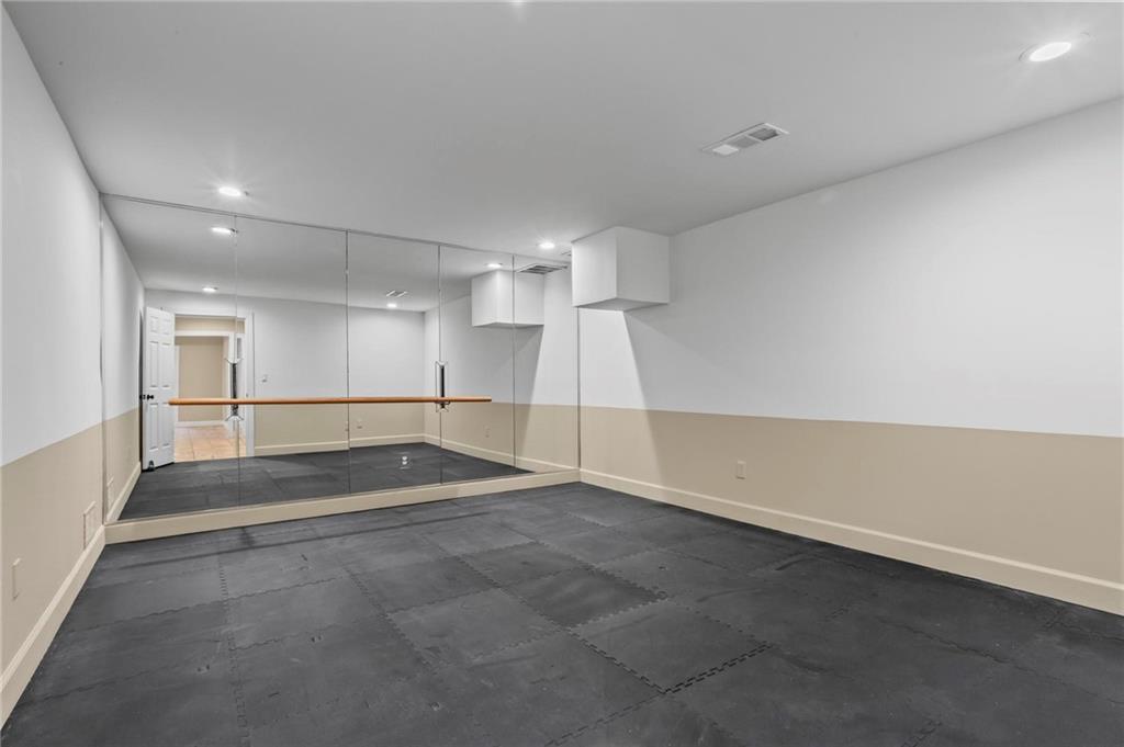 1235 West Garmon Road Northwest Atlanta, GA 30327 - Photo 38 of 46 an empty room with windows and pillars in it