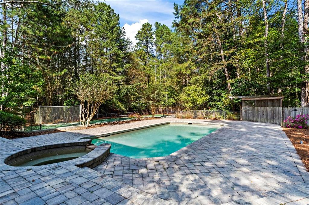 1235 West Garmon Road Northwest Atlanta, GA 30327 - Photo 40 of 46 a view of a backyard with swimming pool