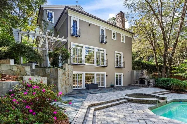a front view of house and yard with green space