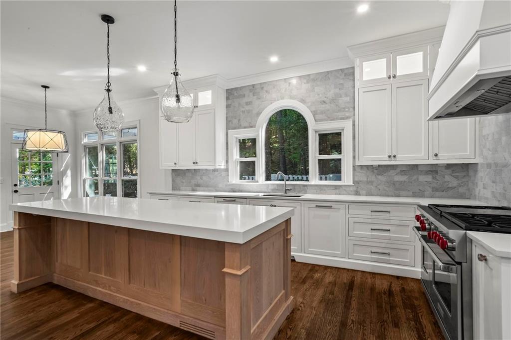 1235 West Garmon Road Northwest Atlanta, GA 30327 - Photo 9 of 46 a kitchen with a sink stove and cabinets