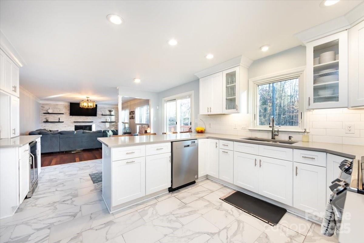 10937 Back Ridge Road Charlotte, NC 28277 - Photo 16 of 45 a kitchen with sink cabinets and window