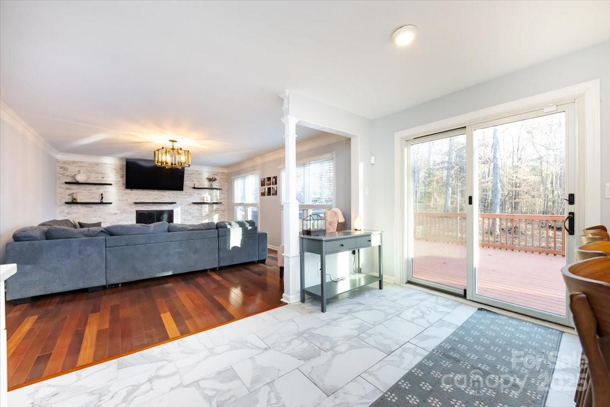10937 Back Ridge Road Charlotte, NC 28277 - Photo 19 of 45 a large living room with a large window and a flat screen tv
