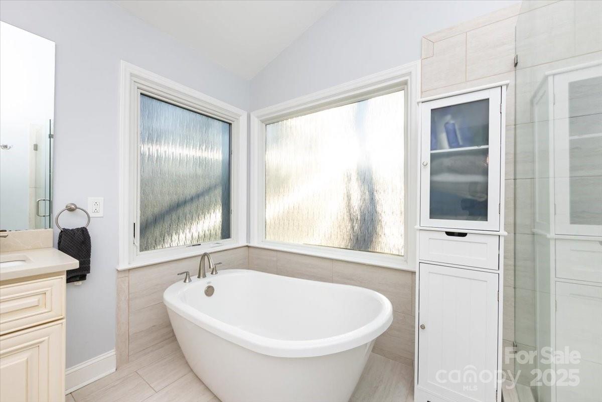 10937 Back Ridge Road Charlotte, NC 28277 - Photo 27 of 45 a white bath tub sitting next to a white sink