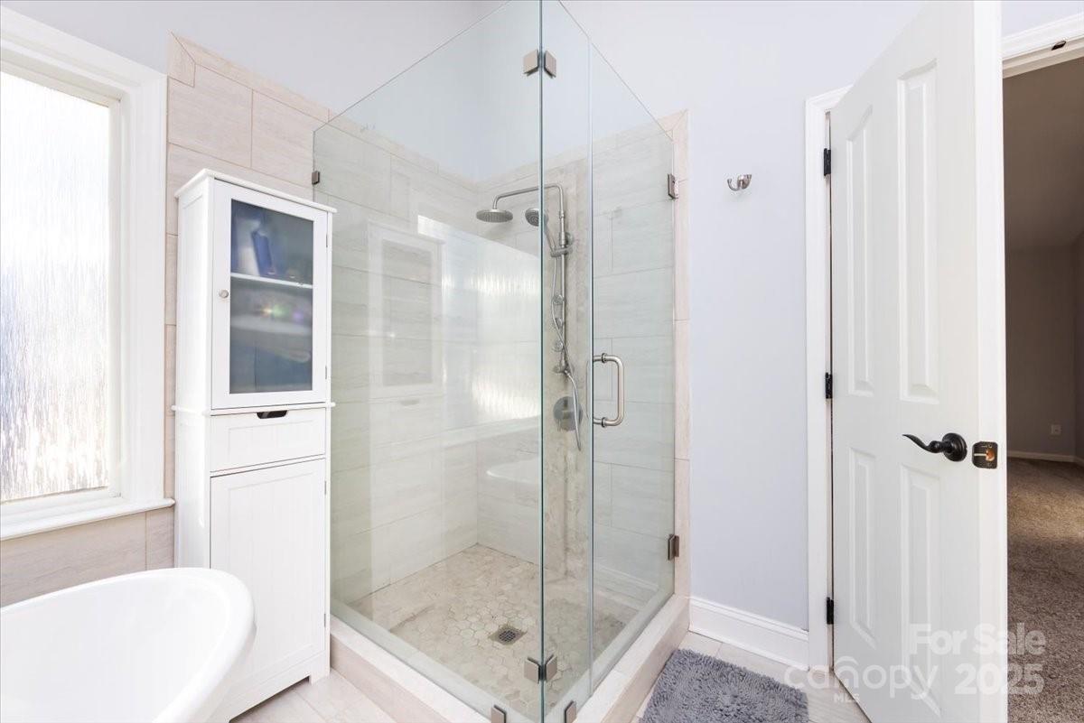 10937 Back Ridge Road Charlotte, NC 28277 - Photo 28 of 45 a bathroom with a shower and a sink