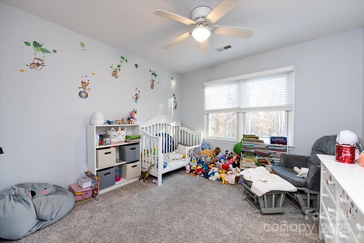 10937 Back Ridge Road Charlotte, NC 28277 - Photo 29 of 45 a living room with furniture toys and a window