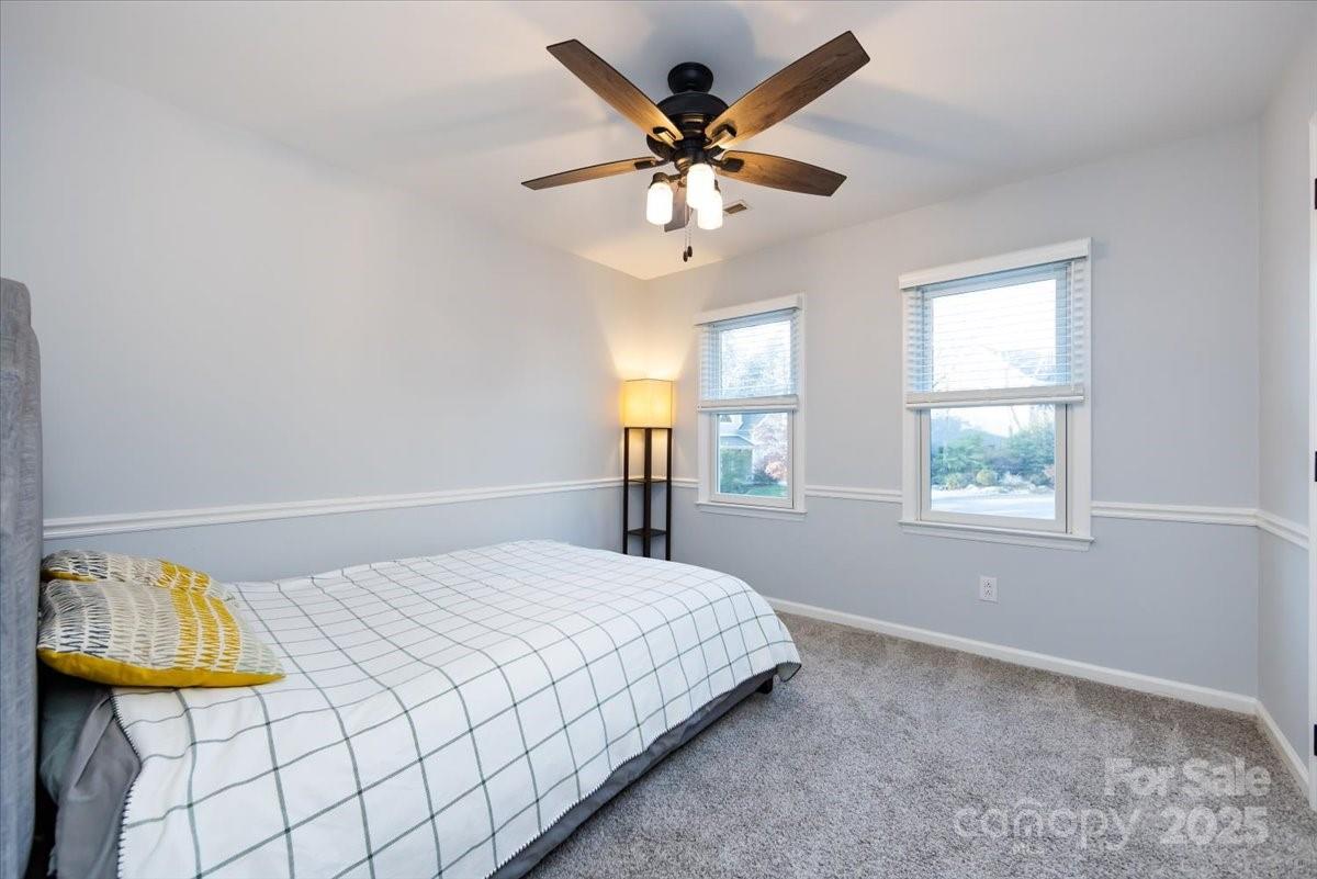 10937 Back Ridge Road Charlotte, NC 28277 - Photo 35 of 45 a bedroom with a bed mirror and window