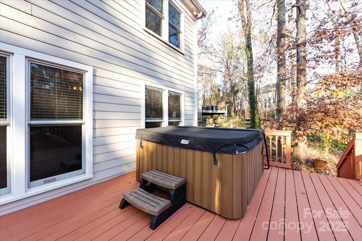 10937 Back Ridge Road Charlotte, NC 28277 - Photo 43 of 45 a backyard of a house with wooden floor table and chairs