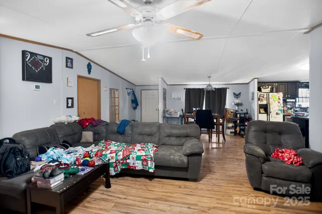 a view of a livingroom with furniture and a window