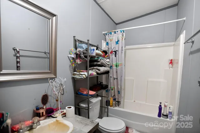 a bathroom with a sink mirror and vanity