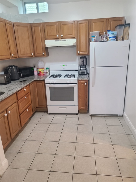 455 Washington Street Haverhill, MA 01832 - Photo 25 of 29 a kitchen with a cabinets and a stove top oven