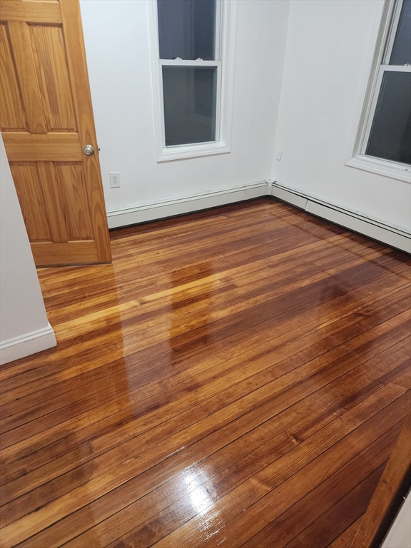 455 Washington Street Haverhill, MA 01832 - Photo 9 of 29 a view of an empty room with wooden floor and a window