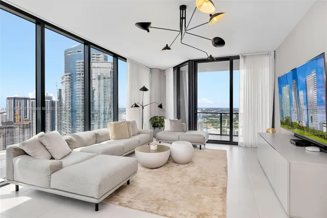 a kitchen with sink cabinets and dining table
