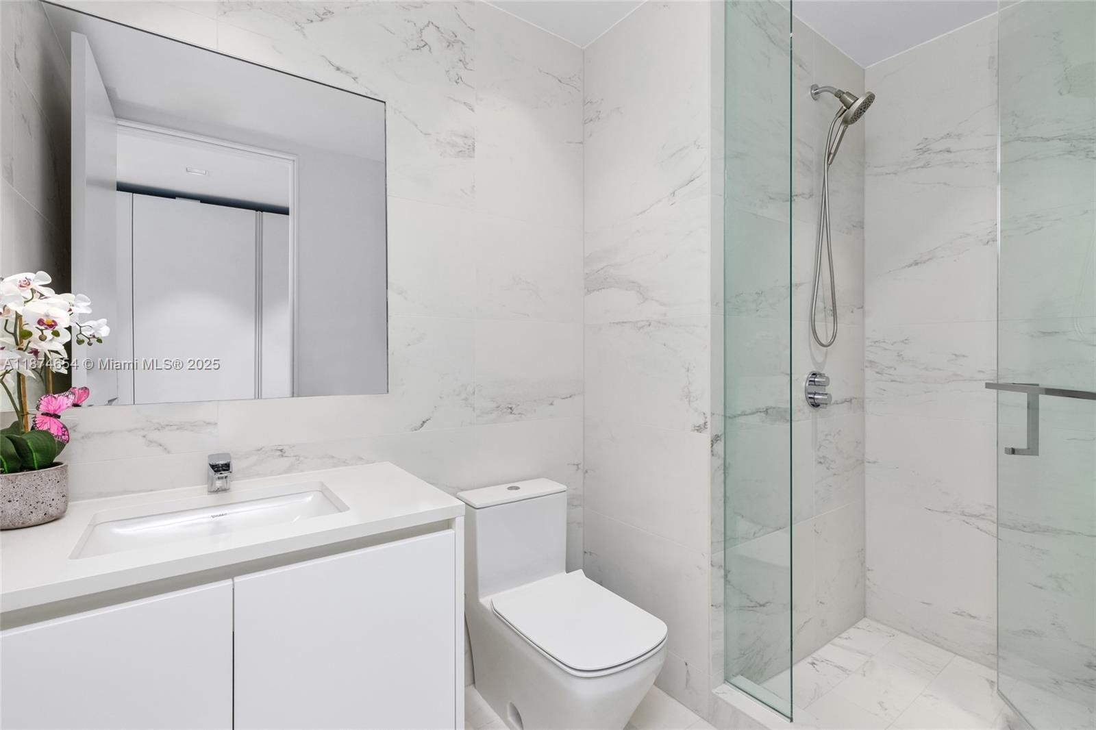 1000 Biscayne Boulevard, Unit 3801 Miami, FL 33132 - Photo 23 of 31 a bathroom with a sink toilet and shower