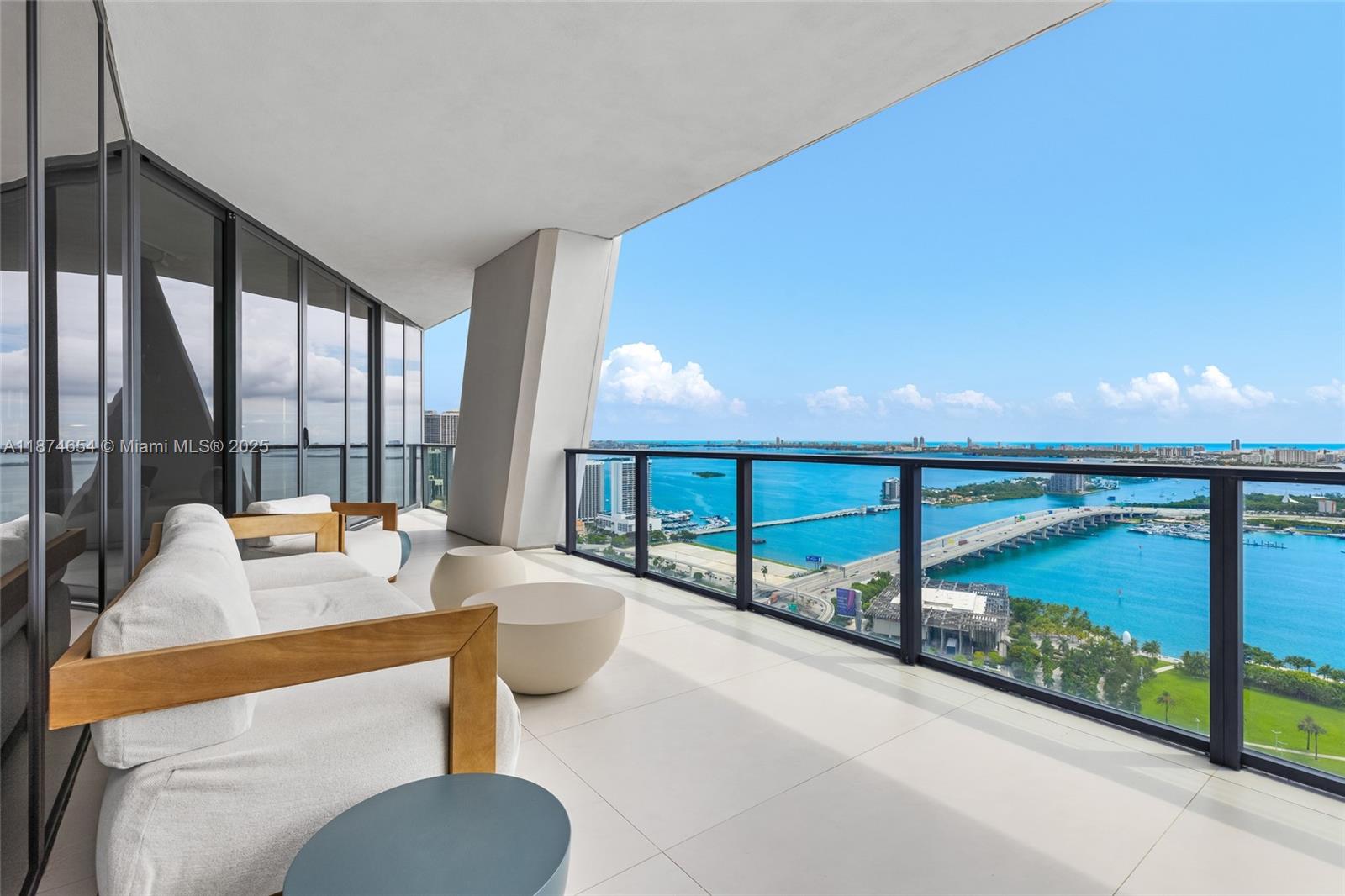 1000 Biscayne Boulevard, Unit 3801 Miami, FL 33132 - Photo 26 of 31 a dining room with furniture and a large window
