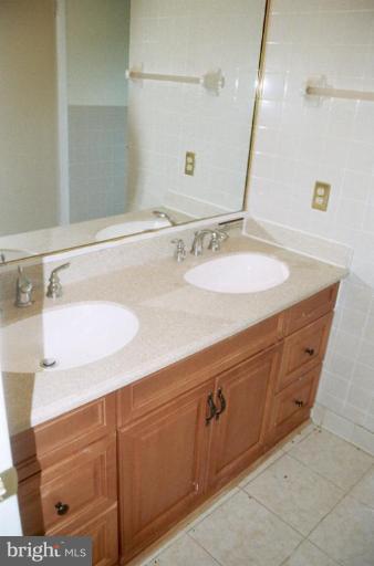 4901 Split Rock Road Alexandria, VA 22310 - Photo 11 of 19 Updated bath w/double vanity & ceramic tile floor.