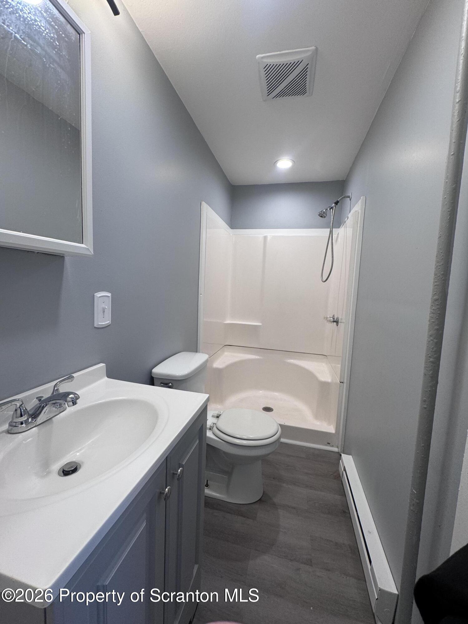 1021 Wheeler Avenue Scranton, PA 18510 - Photo 5 of 10 a bathroom with a sink a toilet and shower