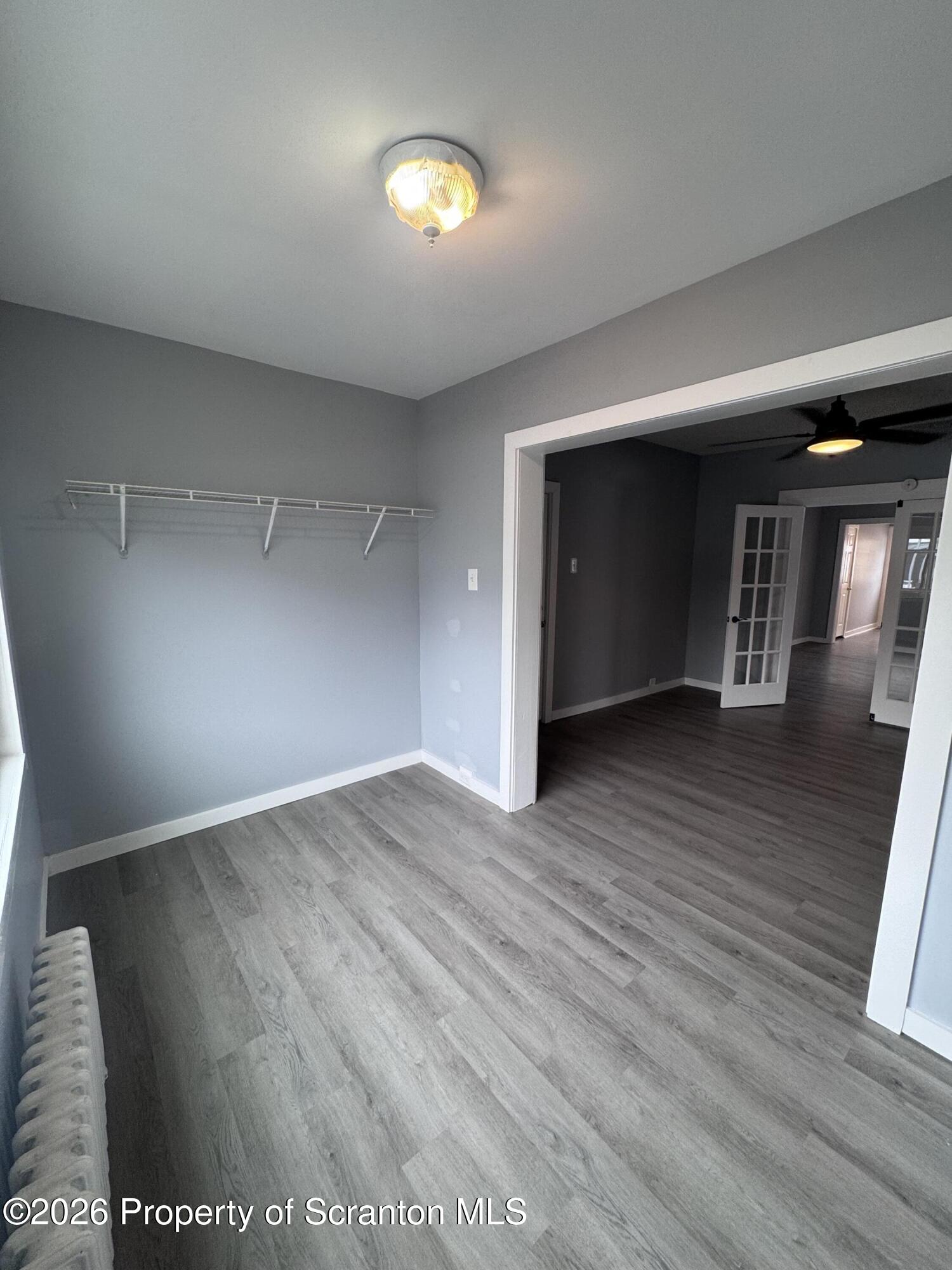 1021 Wheeler Avenue Scranton, PA 18510 - Photo 9 of 10 wooden floor in an empty room with a window