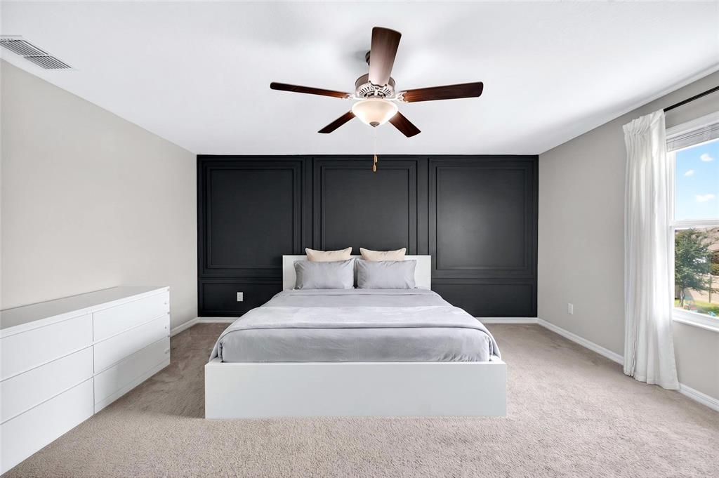 31724 Sun Kettle Loop Wesley Chapel, FL 33545 - Photo 34 of 49 a bedroom with a bed and window