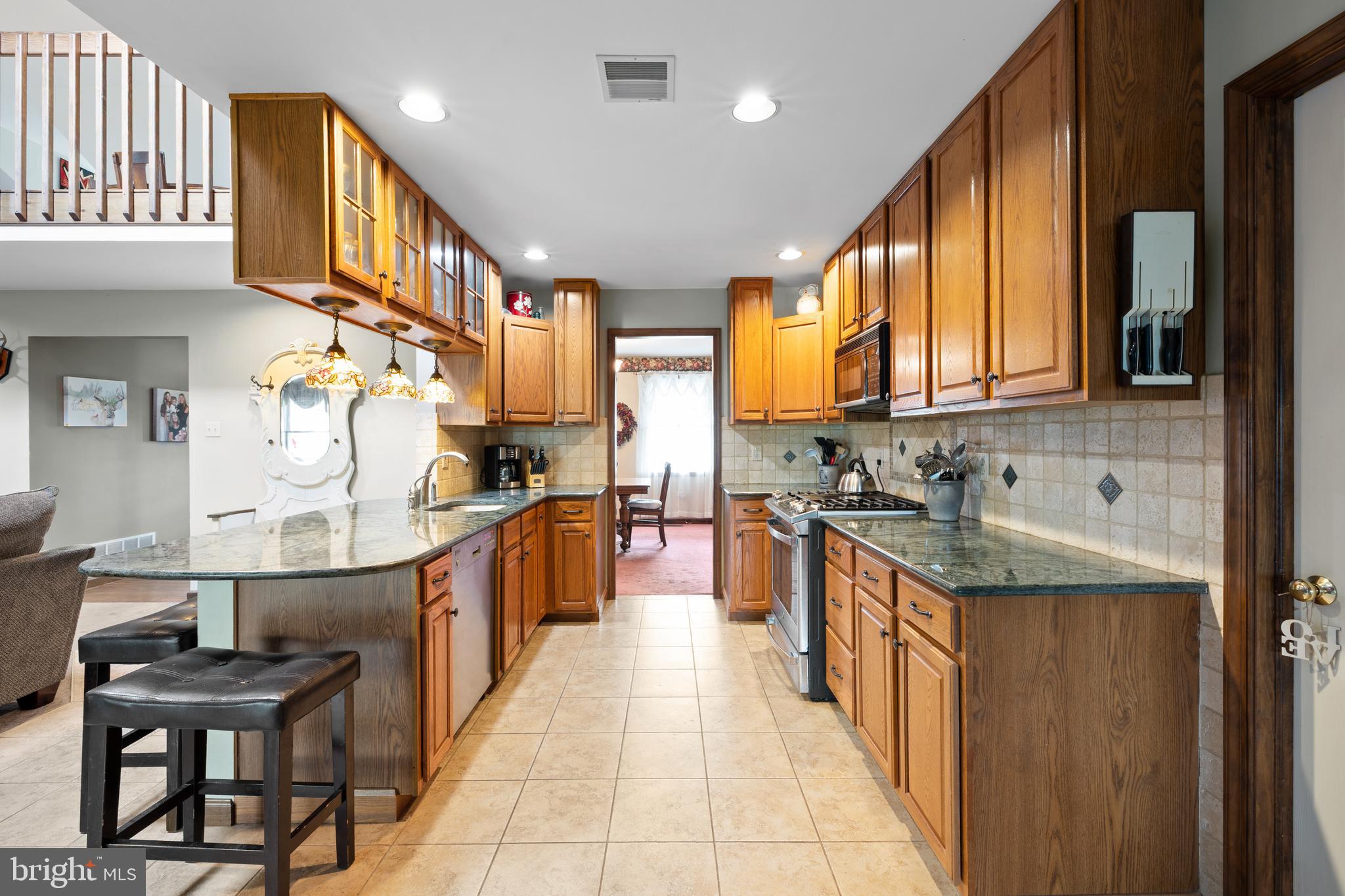 2645 West Buck Road East Greenville, PA 18041 - Photo 15 of 55 a large kitchen with stainless steel appliances granite countertop a sink and cabinets