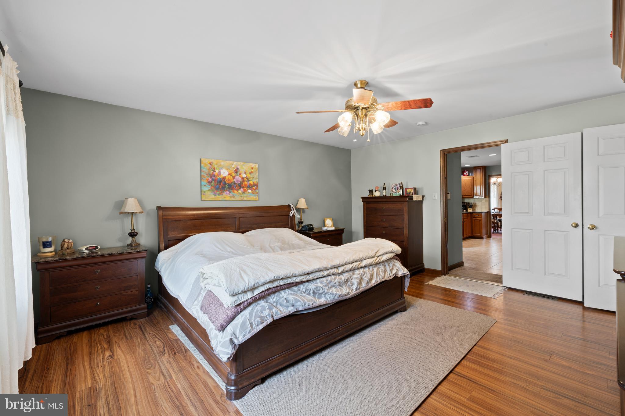 2645 West Buck Road East Greenville, PA 18041 - Photo 17 of 55 a bedroom with a bed and wooden floor