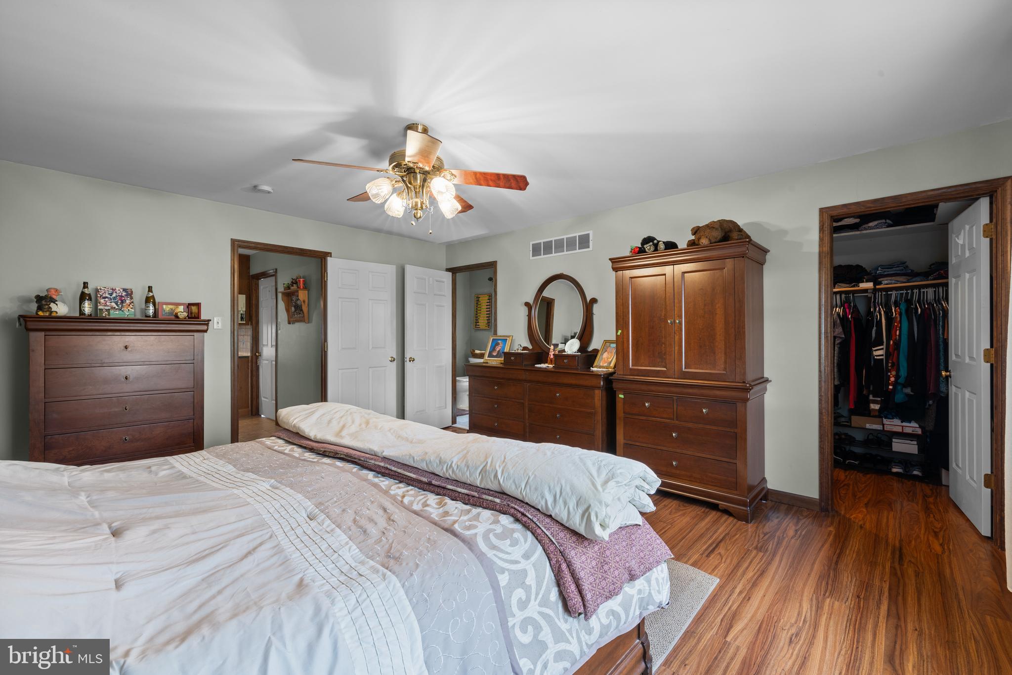 2645 West Buck Road East Greenville, PA 18041 - Photo 18 of 55 a bedroom with a bed and wooden floor