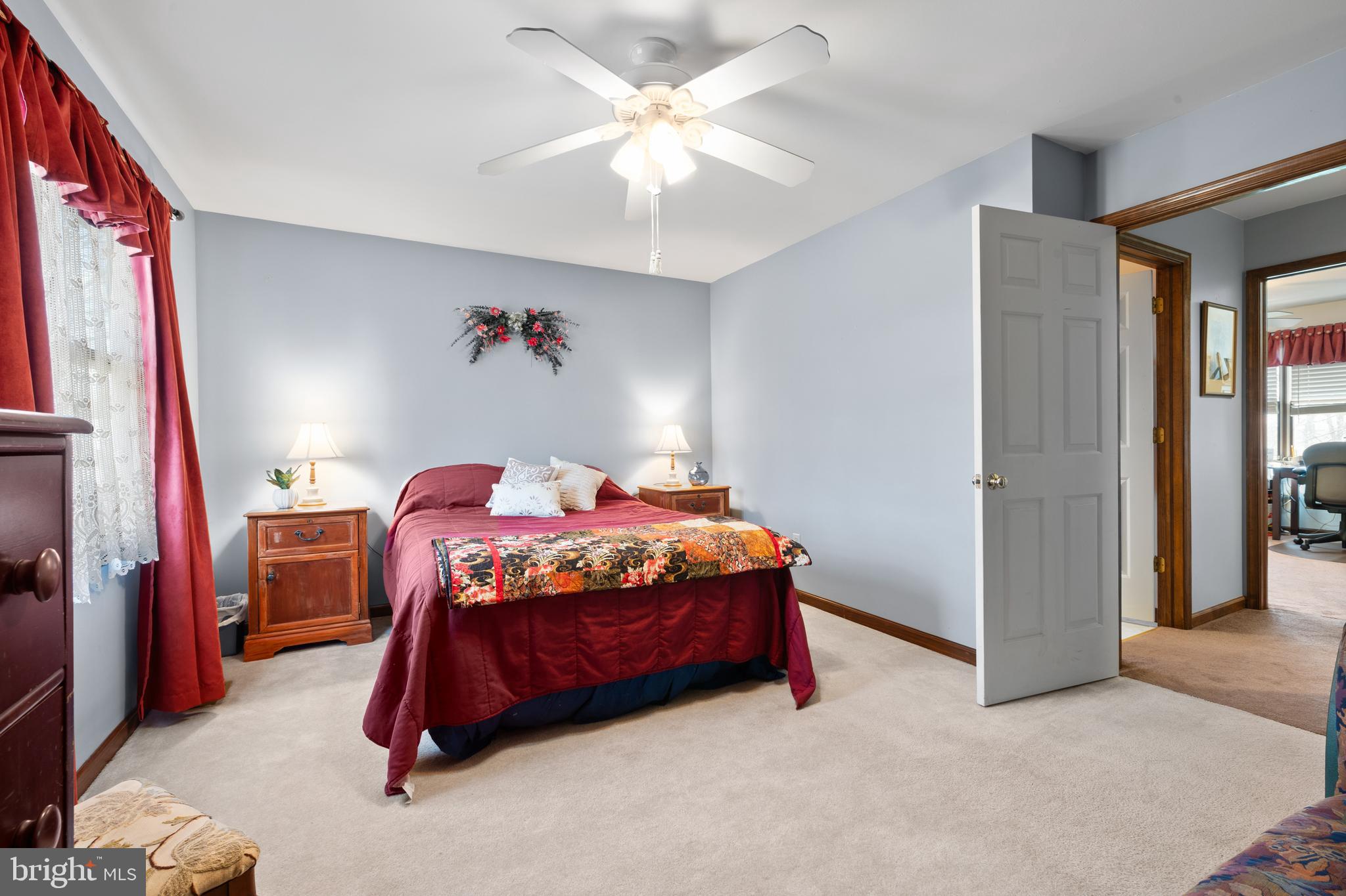 2645 West Buck Road East Greenville, PA 18041 - Photo 26 of 55 a bedroom with a bed and a chandelier