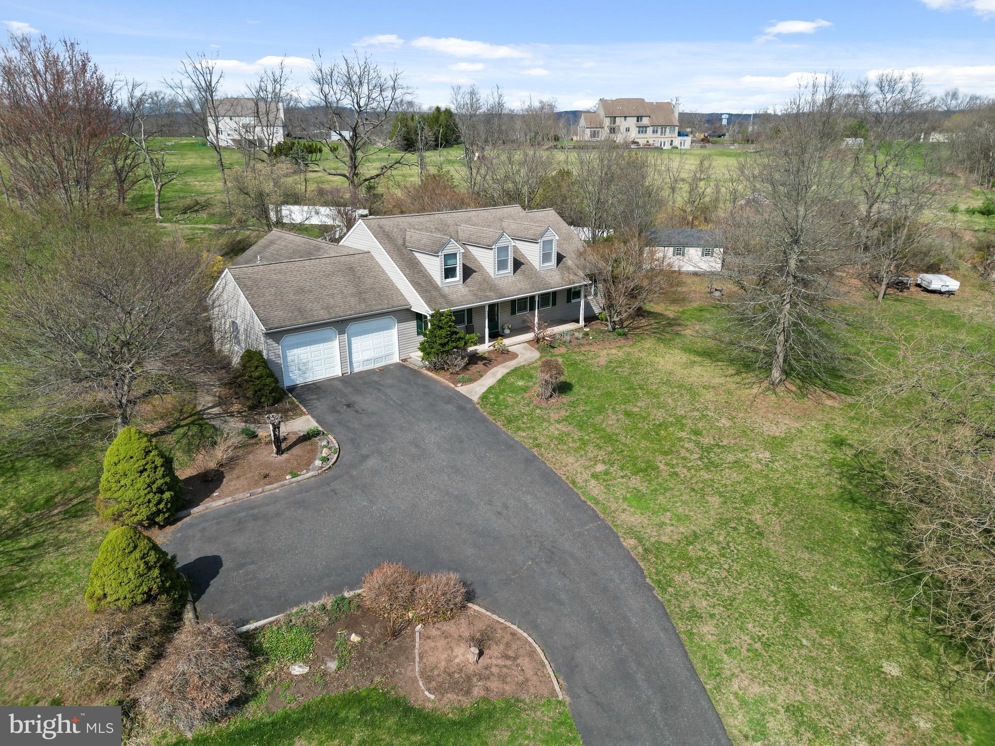 2645 West Buck Road East Greenville, PA 18041 - Photo 40 of 55 an aerial view of a house with a yard and lake view