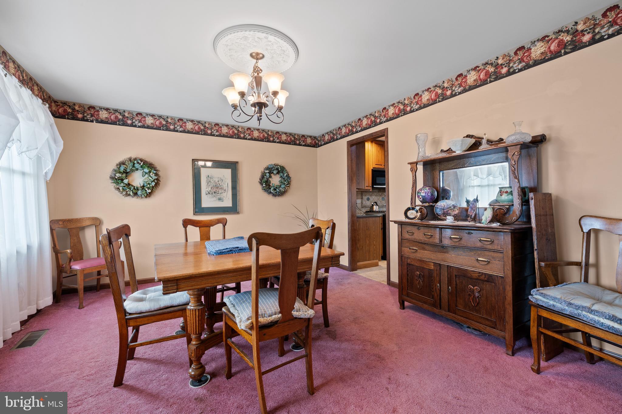2645 West Buck Road East Greenville, PA 18041 - Photo 6 of 55 a view of a dining room with furniture and chandelier