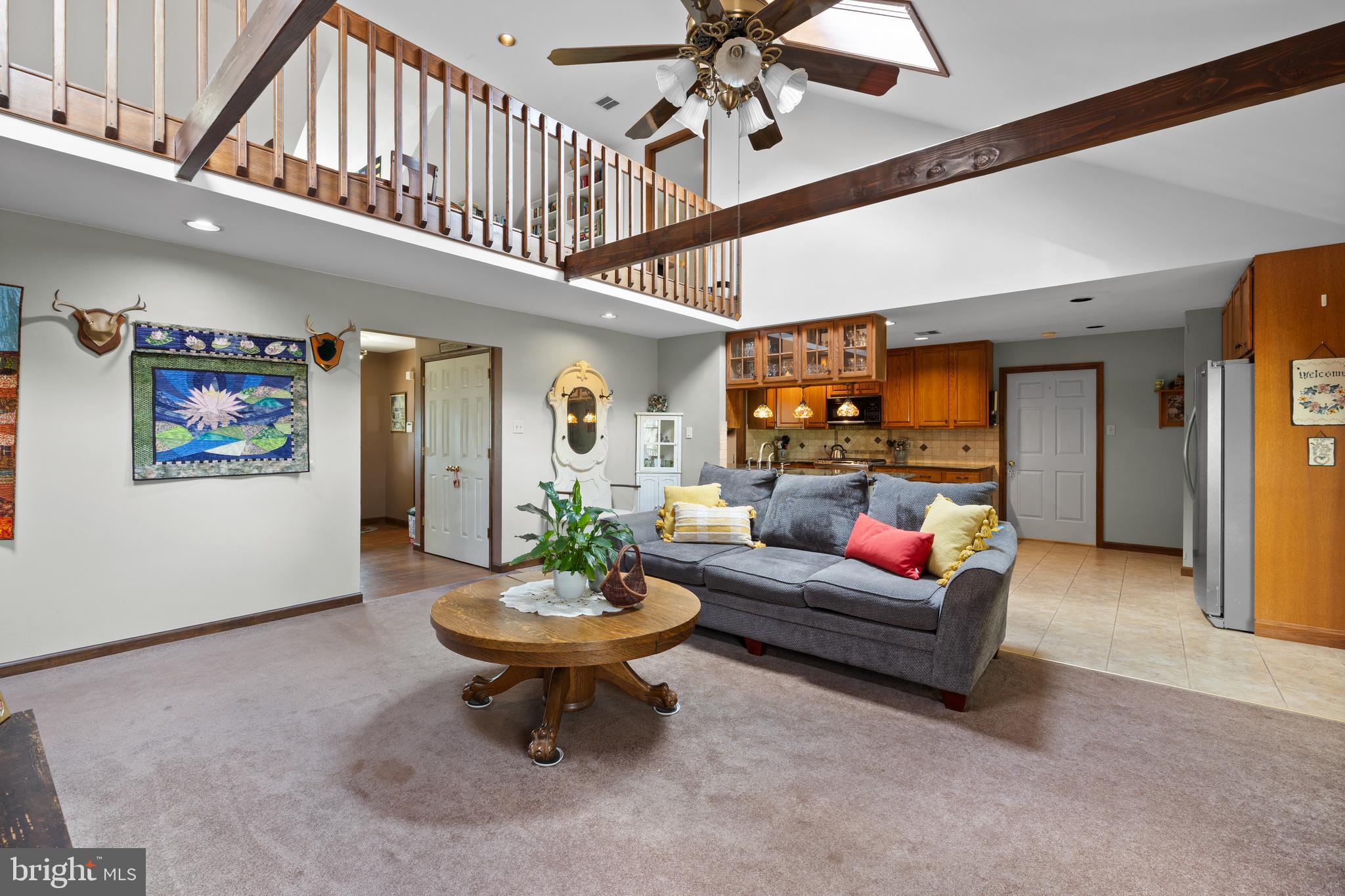 2645 West Buck Road East Greenville, PA 18041 - Photo 9 of 55 a living room with furniture a rug and a ceiling fan
