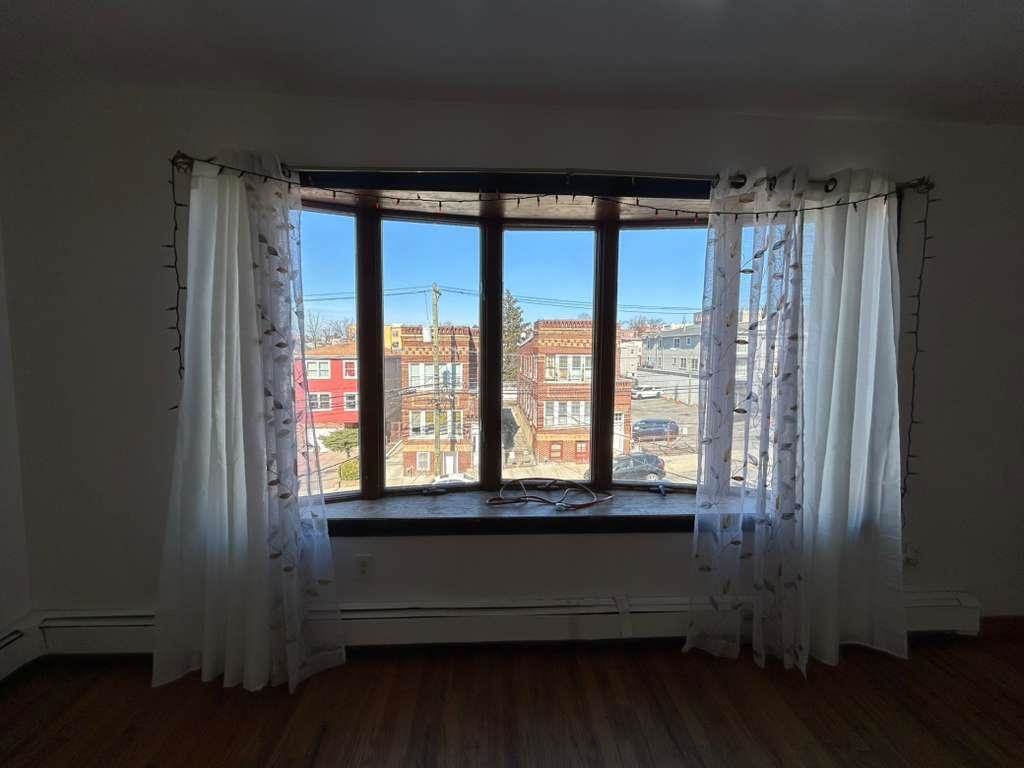 805 Secaucus Road, Unit 2 Jersey City, NJ 07307 - Photo 16 of 21 a view of a room with wooden floor and a window