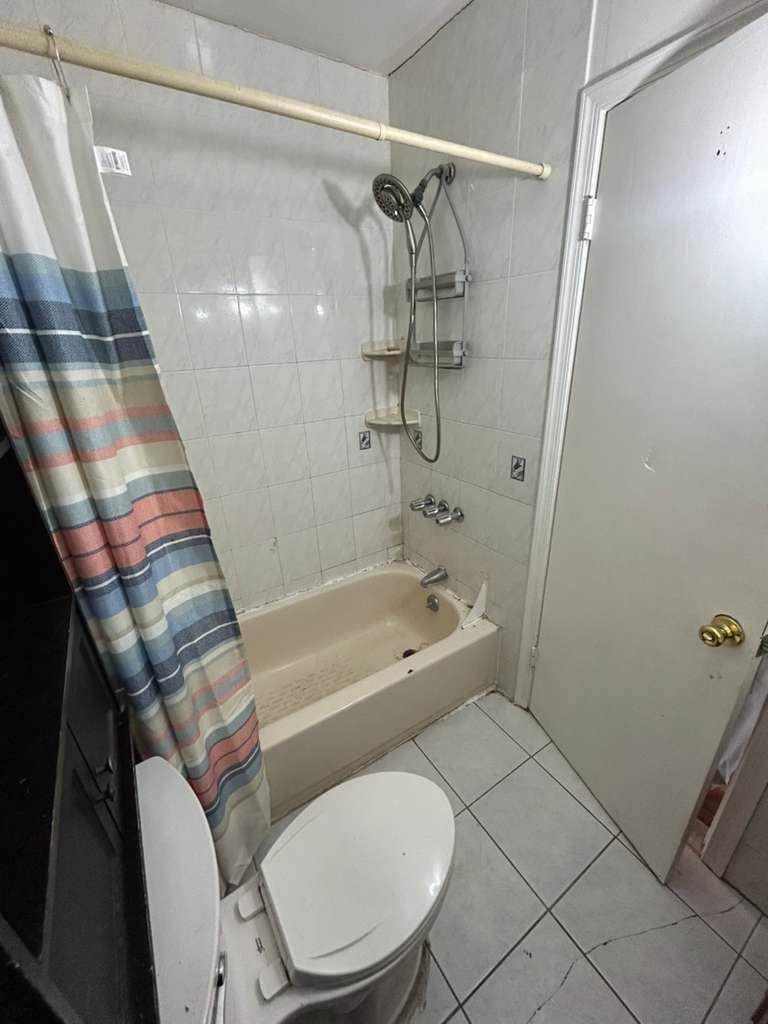 805 Secaucus Road, Unit 2 Jersey City, NJ 07307 - Photo 18 of 21 a bathroom with a toilet and a bathtub