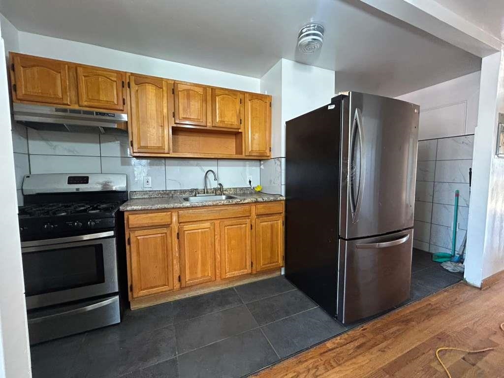 805 Secaucus Road, Unit 2 Jersey City, NJ 07307 - Photo 10 of 21 a kitchen with stainless steel appliances granite countertop a refrigerator stove and sink