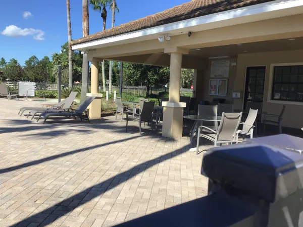 a close view of a sink and dishwasher with kitchen island
