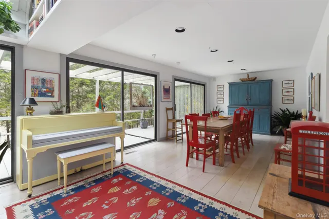 a view of a dining room with furniture window and outside view