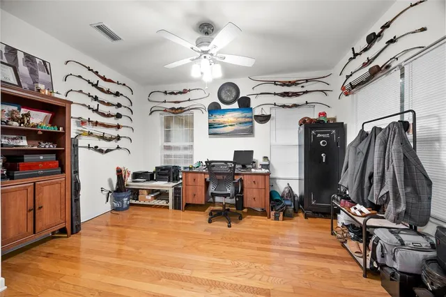 a view of a dining room with furniture wooden floor and chandelier
