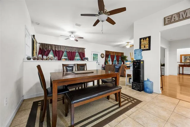 a living room with furniture a rug and a flat screen tv