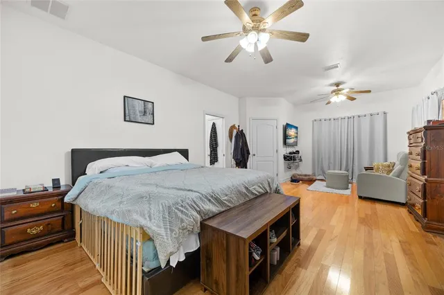 a bathroom with a granite countertop sink mirror and shower