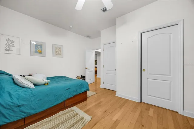 a bathroom with a double vanity sink toilet and a mirror