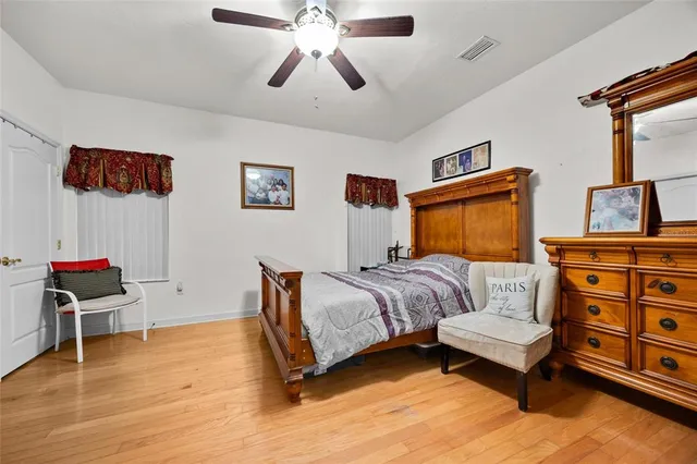 a bedroom with furniture and a chandelier