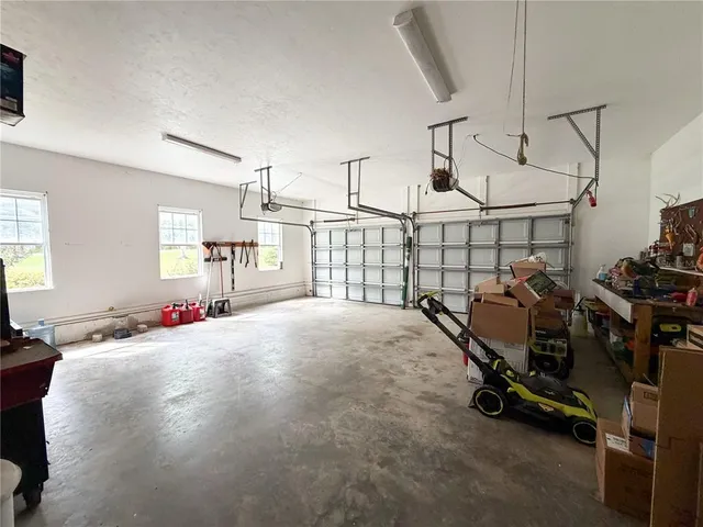 a view of a garage with gym equipment