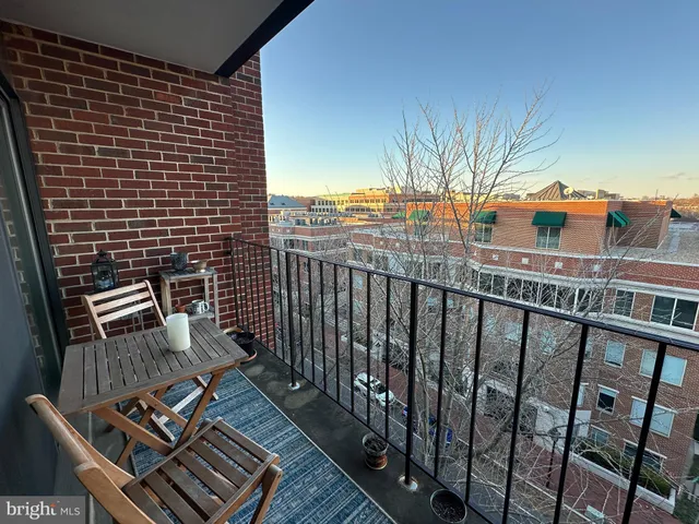 a view of balcony with wooden floor