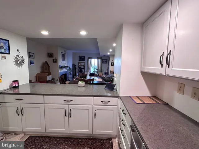 a kitchen with sink and cabinets