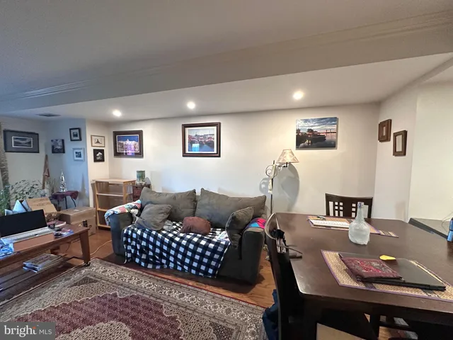 a living room with furniture rug and window