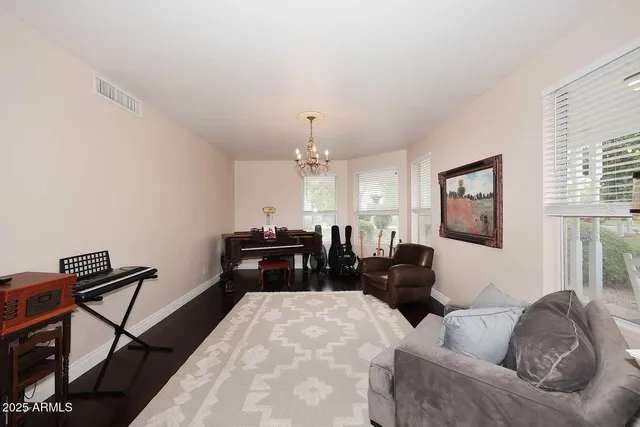 a spacious bathroom with a granite countertop sink a mirror and vanity
