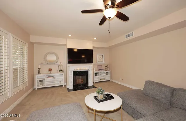 a kitchen with a refrigerator a stove cabinets and a window