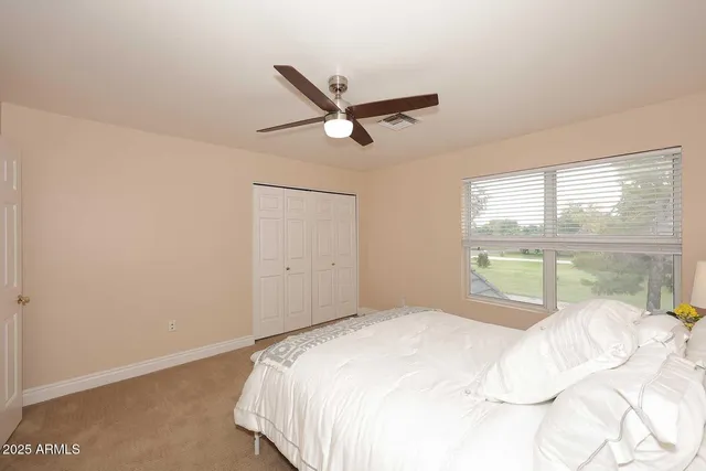 a building outdoor space with patio furniture and potted plants