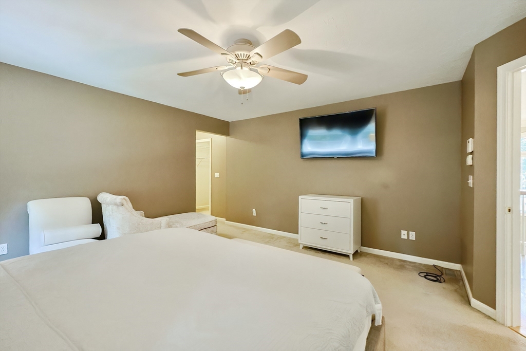 8 Pilgrim Road Ashland, MA 01721 - Photo 24 of 40 a bedroom with a bed and a ceiling fan