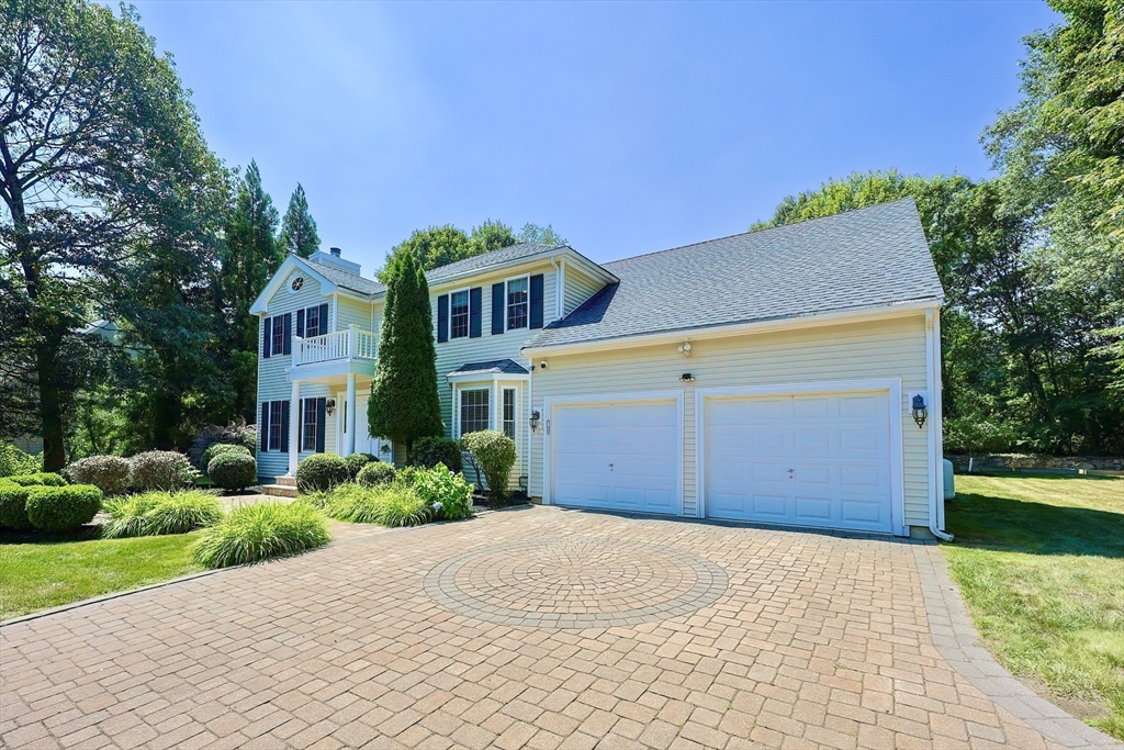 8 Pilgrim Road Ashland, MA 01721 - Photo 3 of 40 a front view of a house with a yard and garage