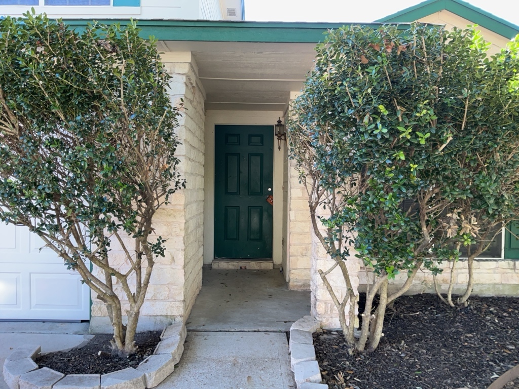 1511 Thibodeaux Drive Round Rock, TX 78664 - Photo 2 of 31 Entrance to property with stone siding