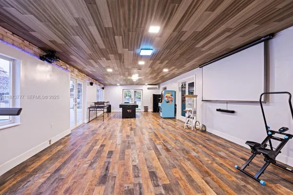 a room with furniture and a flat screen tv